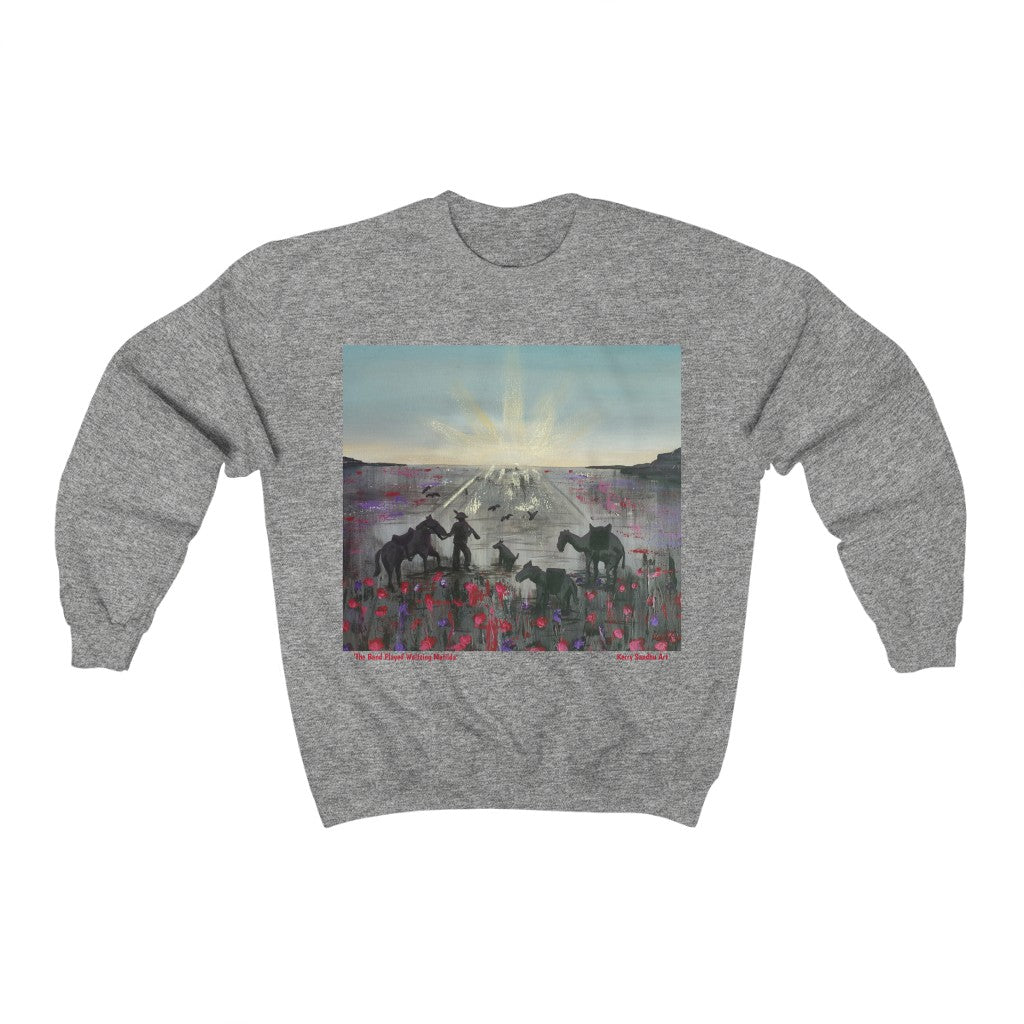 Original painting of a soldier, horse, camel, donkey, dog and birds walking towards an ANZAC Crest inspired sunrise through a field of poppies on the front of a unisex sweatshirt available in various colours