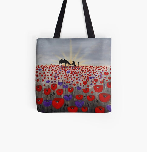 original artwork of a sunrise (in the form of the ANZAC Crest) with a silhouette of a soldier kneeling next to his horse drinking from his hat in a field of red and purple poppies on a 41 x 41cm tote bag
