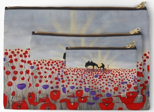 Original artwork of a sunrise (in the form of the ANZAC Crest) with a silhouette of a soldier kneeling next to his horse drinking from his hat in a field of red and purple poppies on three sizes of zipper pouches.