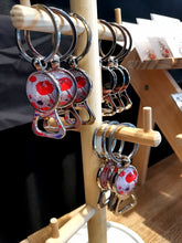 Load image into Gallery viewer, A Bottle opener and keyring in one! Designed from original ANZAC Day art by Kerry Sandhu Art
