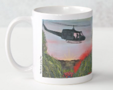 Load image into Gallery viewer, Original painting of a huey helicopter hovering over red smoke and poppies in Vietnam on a ceramic mug
