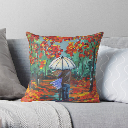 original painting of a couple under an umbrella surrounded by autumn / fall coloured leaves on a 40 x 40cm cushion cover