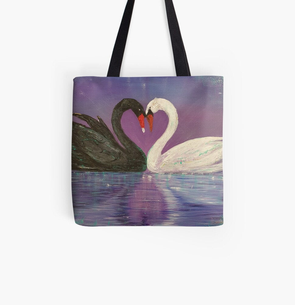 Original painting of a black and a white swan touch heads to form a love heart with the heart reflecting in the water on a 33 x 33cm tote bag