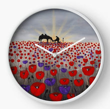 Load image into Gallery viewer, original artwork of a sunrise (in the form of the ANZAC Crest) with a silhouette of a soldier kneeling next to his horse drinking from his hat in a field of red and purple poppies on a clock
