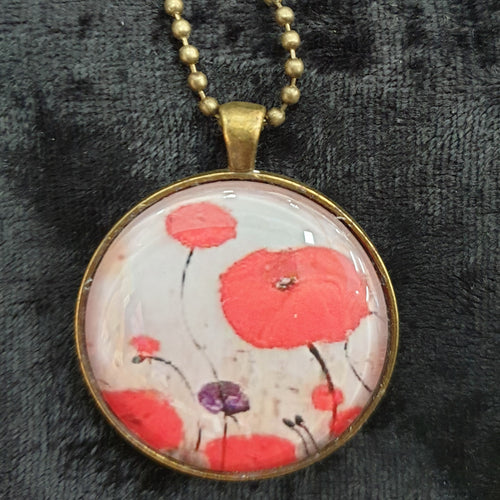 Original painting of red poppies with an abstract background on a bronze coloured 38mm pendant with a 60cm ball chain