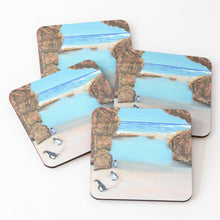 Load image into Gallery viewer, Original artwork of penguins walking up a rocklined beach on cork backed coasters
