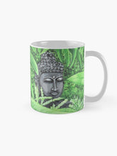 Load image into Gallery viewer, Original painting of a serene buddha head statue in a garden on a ceramic mug
