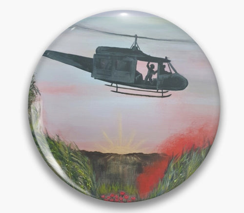 Original painting of a huey helicopter hovering over red smoke and poppies in Vietnam on a unisex pin