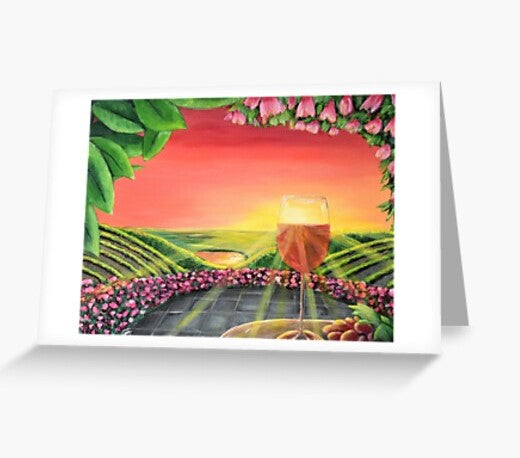 Sunrays filtering through a glass of red wine on a patio table w/ grapes overlooking a flowerbed & vineyard - blank card