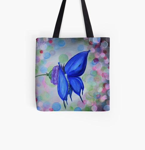 Original painting of a blue butterfly on a purple flower with coloured bokeh lights behind on a 33 x 33cm tote bag