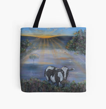Load image into Gallery viewer, Original painting of  a black and white cow eating with the sun rising on a 41 x 41cm tote bag
