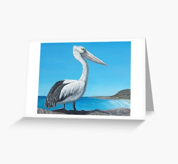 Original painting of an Australian pelican standing rocks overlooking a beach on a blank card