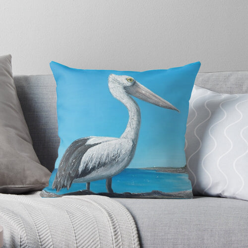 Original painting of an Australian pelican standing rocks overlooking a beach on 40 x 40cm cushion covers